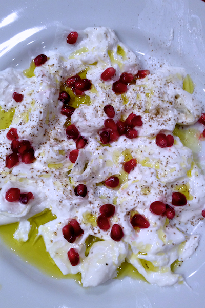 Burrata cheese with pomegranate and olive oil